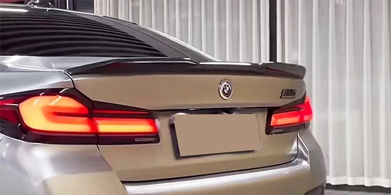 Topcar spoiler is available in gloss black and carbon fiber.